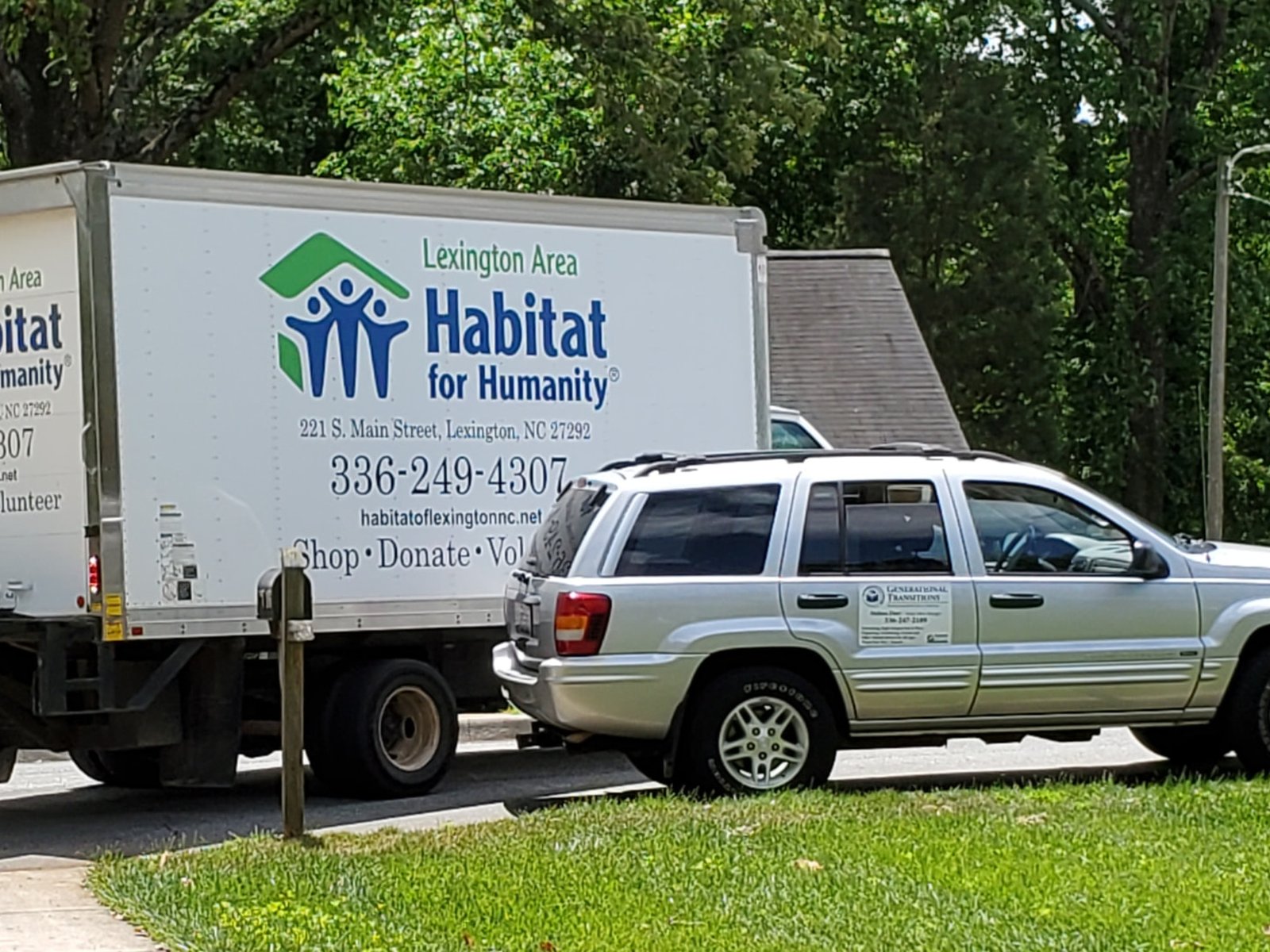 The Generational Transitions vehicle alongside a Habitat for Humanity donation truck